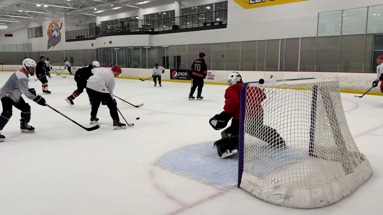 Orlando firefighters play hockey to raise money for families