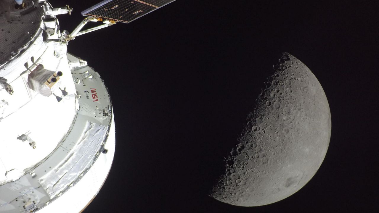 NASA’s Orion spacecraft is seen in the foreground, lit up by the sun. (NASA)