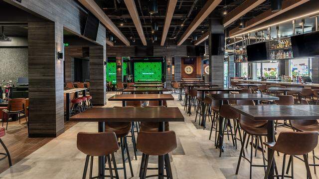 The interior of the new Play Sporting Lounge in Doral, which offers suites with high tech sports games and an outdoor patio with backyard games.