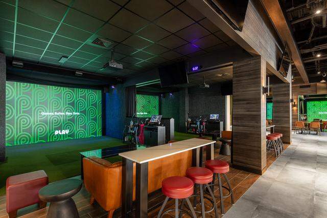 One of the game suites at Play Sporting Lounge, where you can play high-tech football, soccer, golf, basketball — or hit a zombie with a dodgeball.