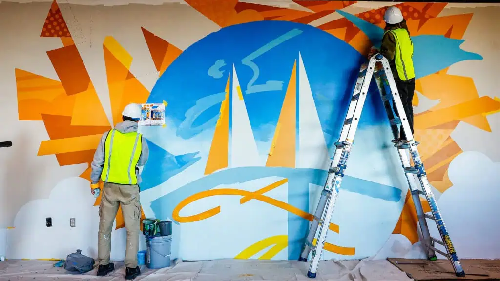 People painting a mural