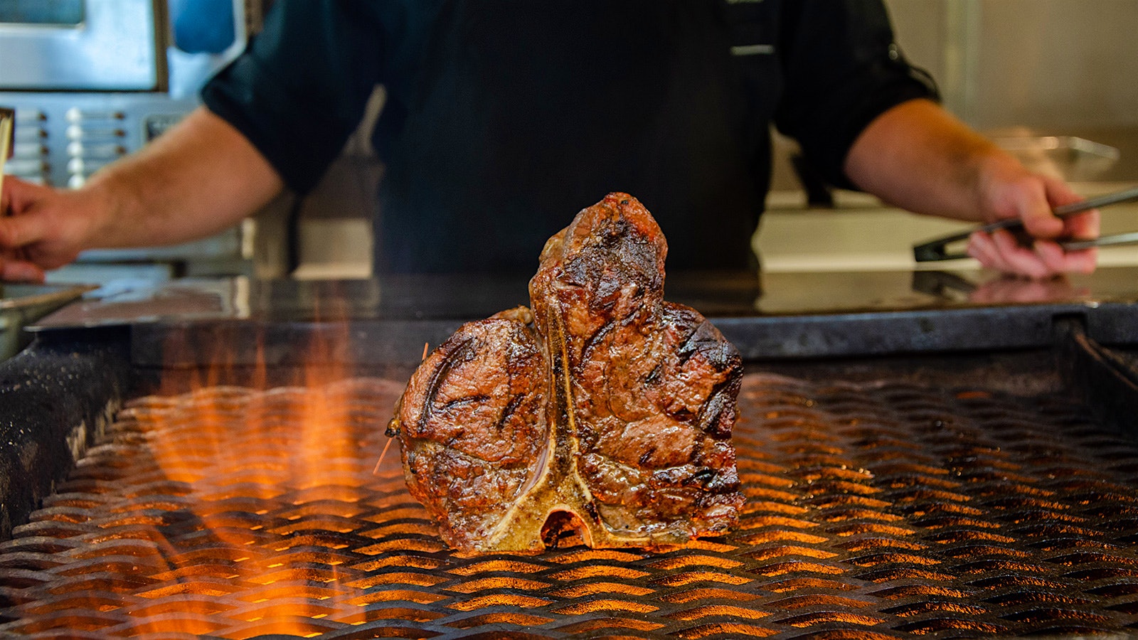  A steak on a grill at Charley’s Steak House.