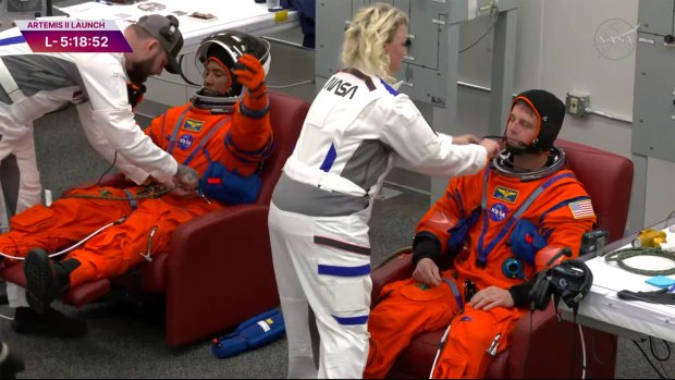 NASA astronauts Victor Glover, left, and Reid Wiseman, right get suited up ahead of their trip to the launch pad for the Artemis II mission on Wednesday, April 1, 2026. (NASA)