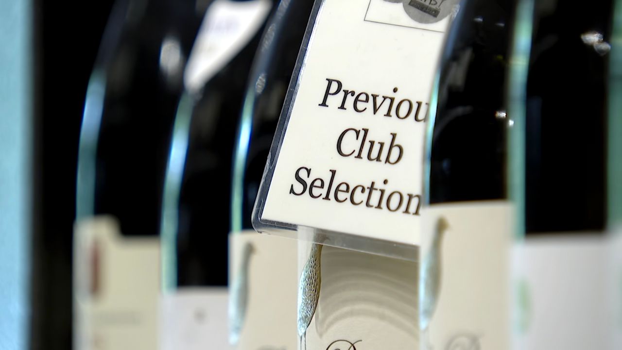 Rollins College professor Mark Johnston says that many small businesses — like Tim's Wine Market in Orlando — will probably not see any money from tariff refunds, at least not directly. (Spectrum News/Benjamin Booker)