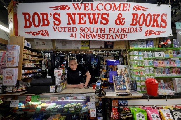Erin Steinberg behind the counter at Bob's News and Books on Andrews Avenue in Fort Lauderdale on Friday, March 27, 2026. (Mike Stocker/South Florida Sun Sentinel)