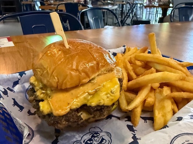 Pig Beach BBQ's Smash Burger includes griddled onions, dill pickles, secret sauce and yellow American cheese on a Martin's potato roll. (Sef Gonzalez / Courtesy)