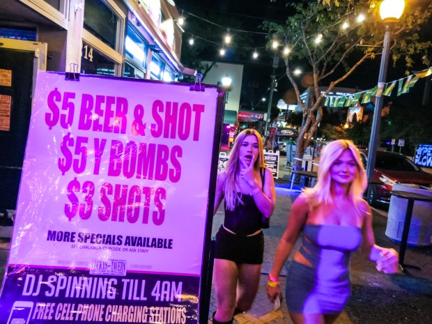 Patrons roam from bar to bar during Spring Break on Himmarshee Street in downtown Fort Lauderdale on March 20, 2025. (Scott Luxor/Contributor)