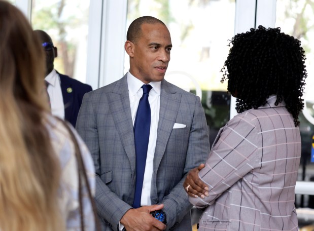 U.S. Department of Housing and Urban Development (HUD) Secretary Scott Turner greets Urban League staff before taking part in a roundtable discussion on "Opportunity Zones" at the Urban League of Broward County in Fort Lauderdale on Wednesday, April 15, 2026. (Carline Jean/South Florida Sun Sentinel)