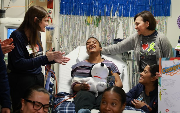 Social worker Alexa Zucker, left, and nurse manager Sasha Medvinsky spend time with patient Arianna Crockett, 18, of Deerfield Beach, hours before her kidney transplant surgery at Joe DiMaggio Children's Hospital in Hollywood on Wednesday, April 8, 2026. (Carline Jean/South Florida Sun Sentinel)