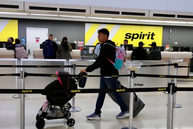 Travelers wait in line at the Spirit Airlines service desk in Terminal 4 at Fort Lauderdale-Hollywood International Airport on Thursday, April 16, 2026. (Joe Cavaretta/South Florida Sun Sentinel)