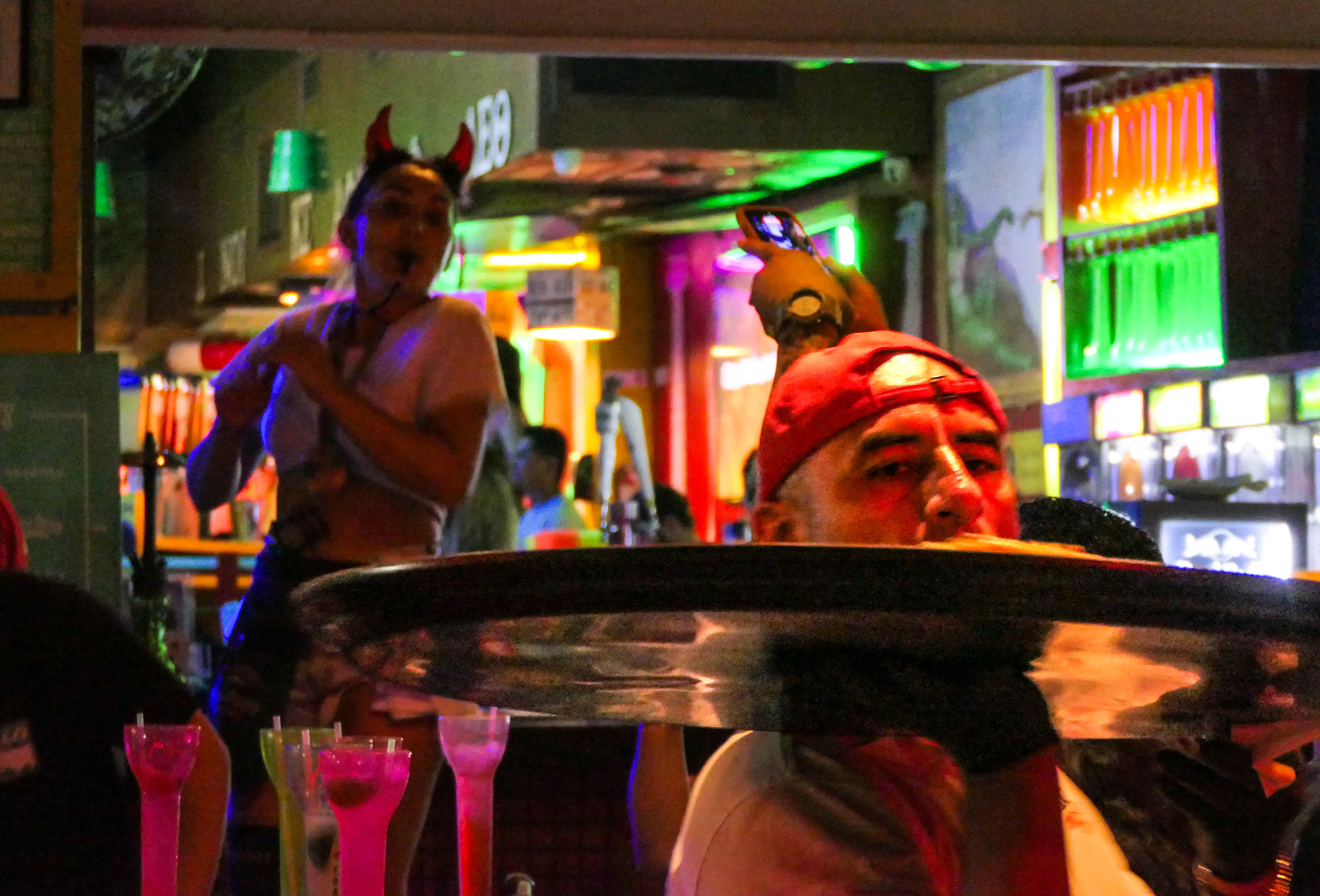 People visit bars along A1A as the Fort Lauderdale beachfront...