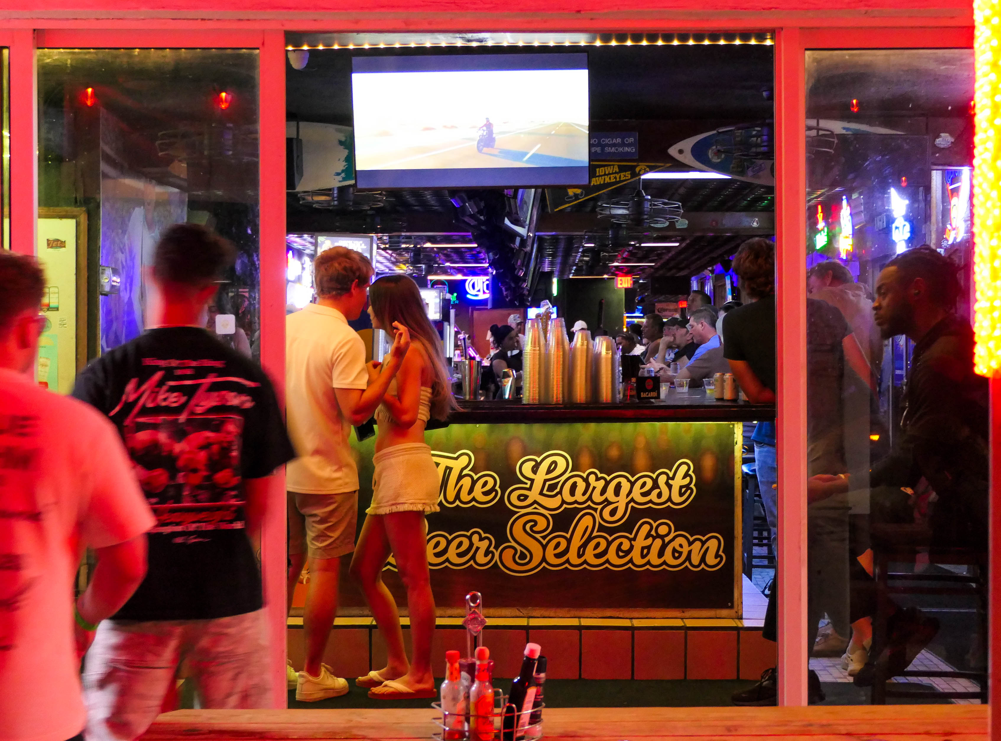 People visit bars along A1A as the Fort Lauderdale beachfront...