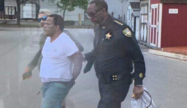 Man being taken into custody