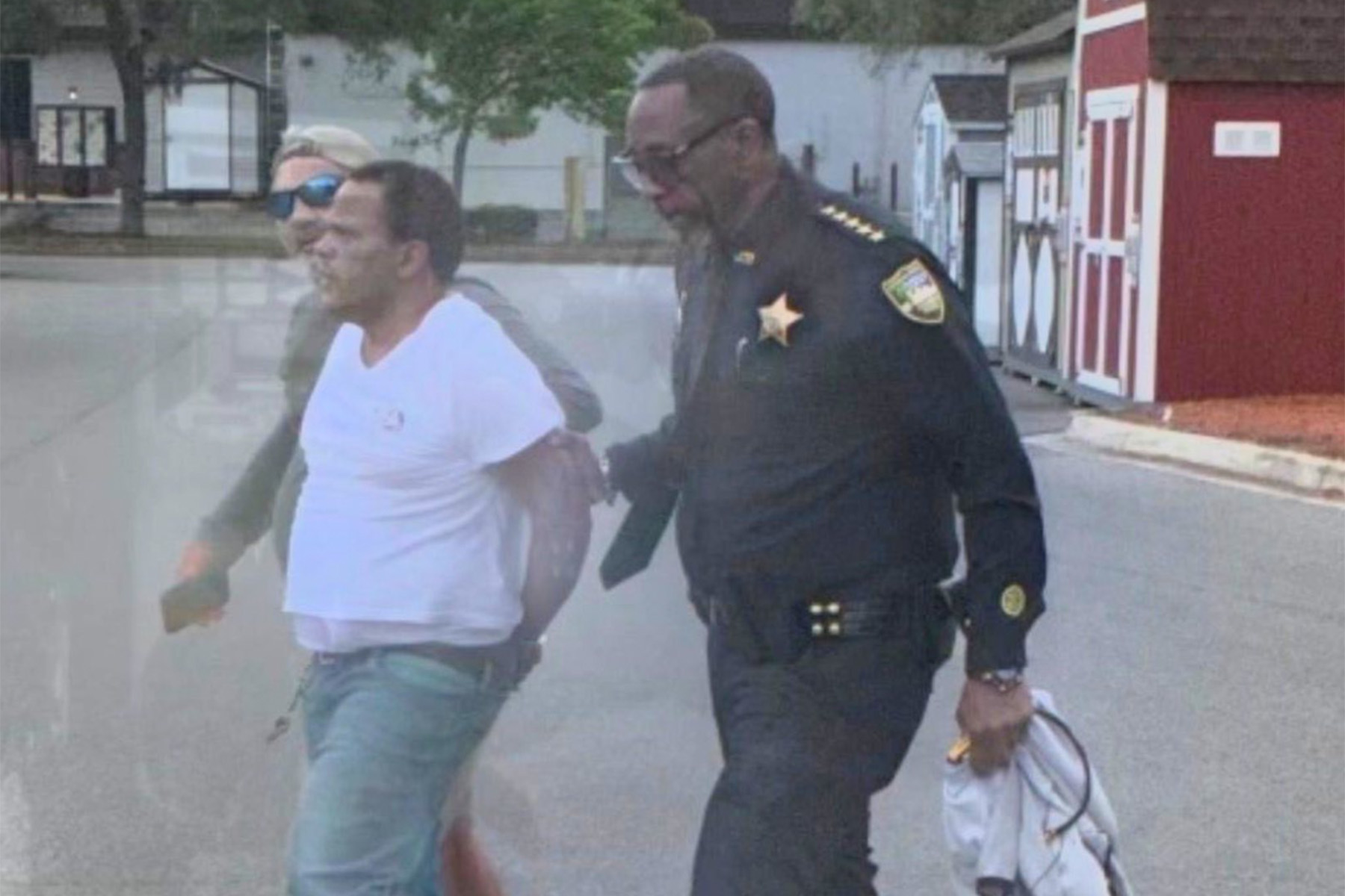 Man being taken into custody