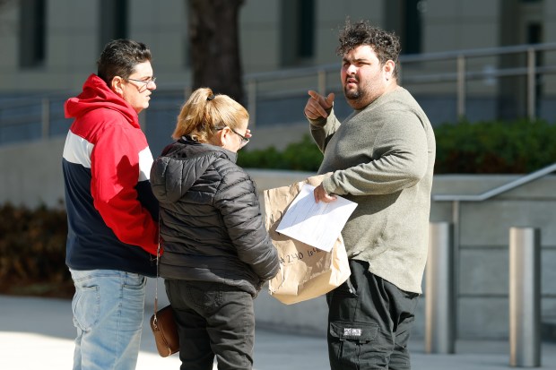 Yoey Lleo-Rodriguez, right, an immigrant detainee from Cuba, is greeted as he leaves the George C. Young Federal Annex Courthouse on Tuesday, February 3, 2026, after being released from ICE custody following a hearing in which a judge determined that the government was wrongly detaining him. (Rich Pope/Orlando Sentinel)