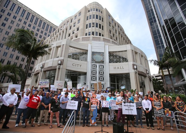 Demonstators cheer in front of Orlando City Hall, Tuesday, Sept. 5, 2017, protesting proposed changes to the federal DACA program. Protests were held across the country Tuesday to challenge the Trump administration's initiative.