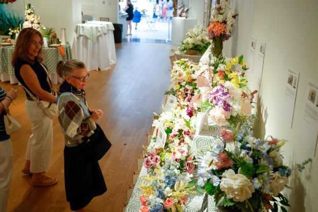 A table of arrangements that are raffled off to raise funds for the museum is on display at the Orlando Museum of Art during Art in Bloom, the annual Council of 101 event and fundraiser, on Friday, April 10, 2026.(Rich Pope/Orlando Sentinel)