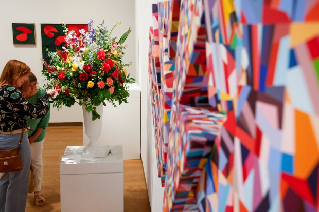 Art and flowers share attention in the galleries of the Orlando Museum of Art during Art in Bloom, the annual Council of 101 floral-inspired event and fundraiser, on Friday, April 10, 2026. (Rich Pope/Orlando Sentinel)