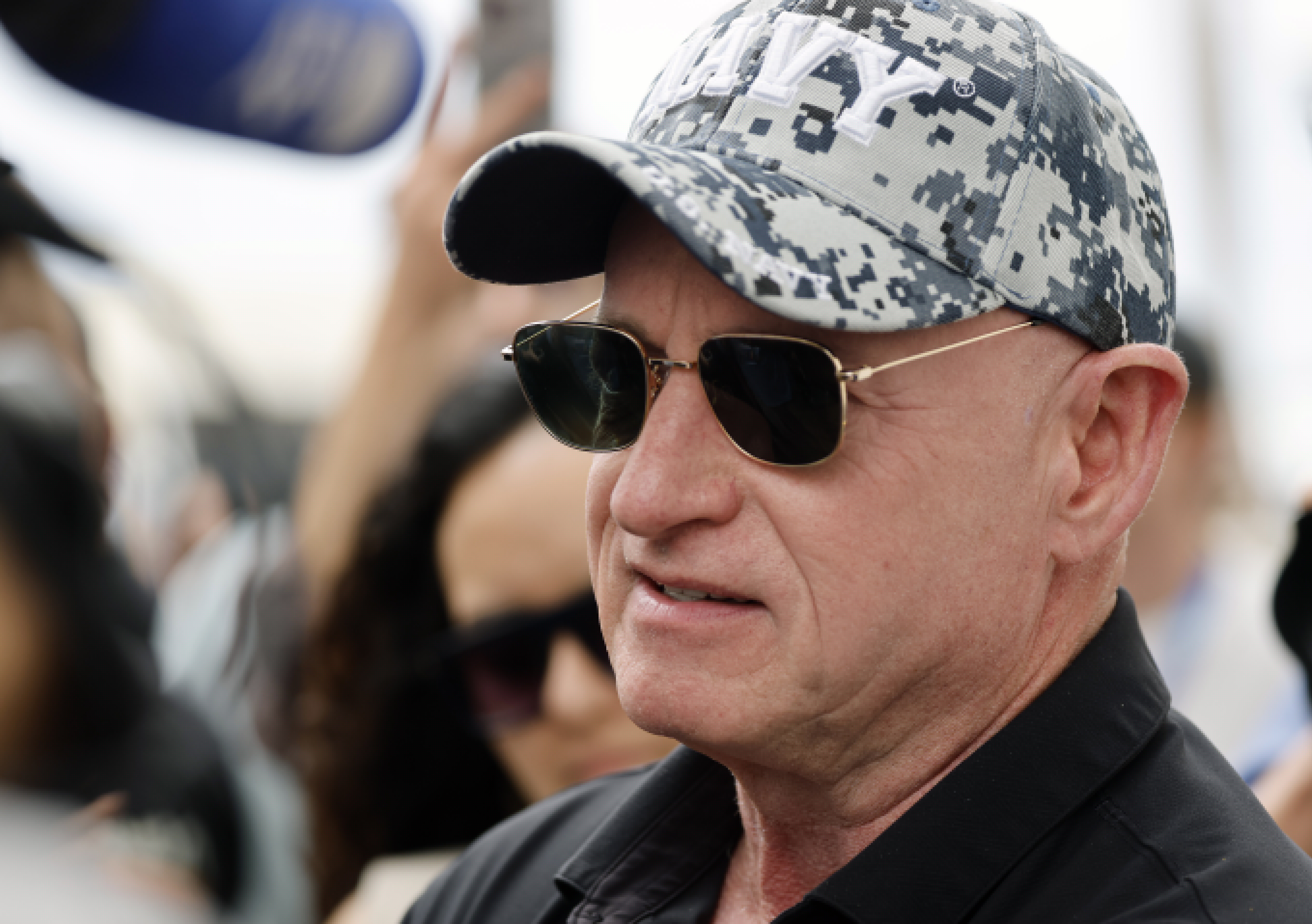 Senator and former astronaut Mark Kelly talks to the media...