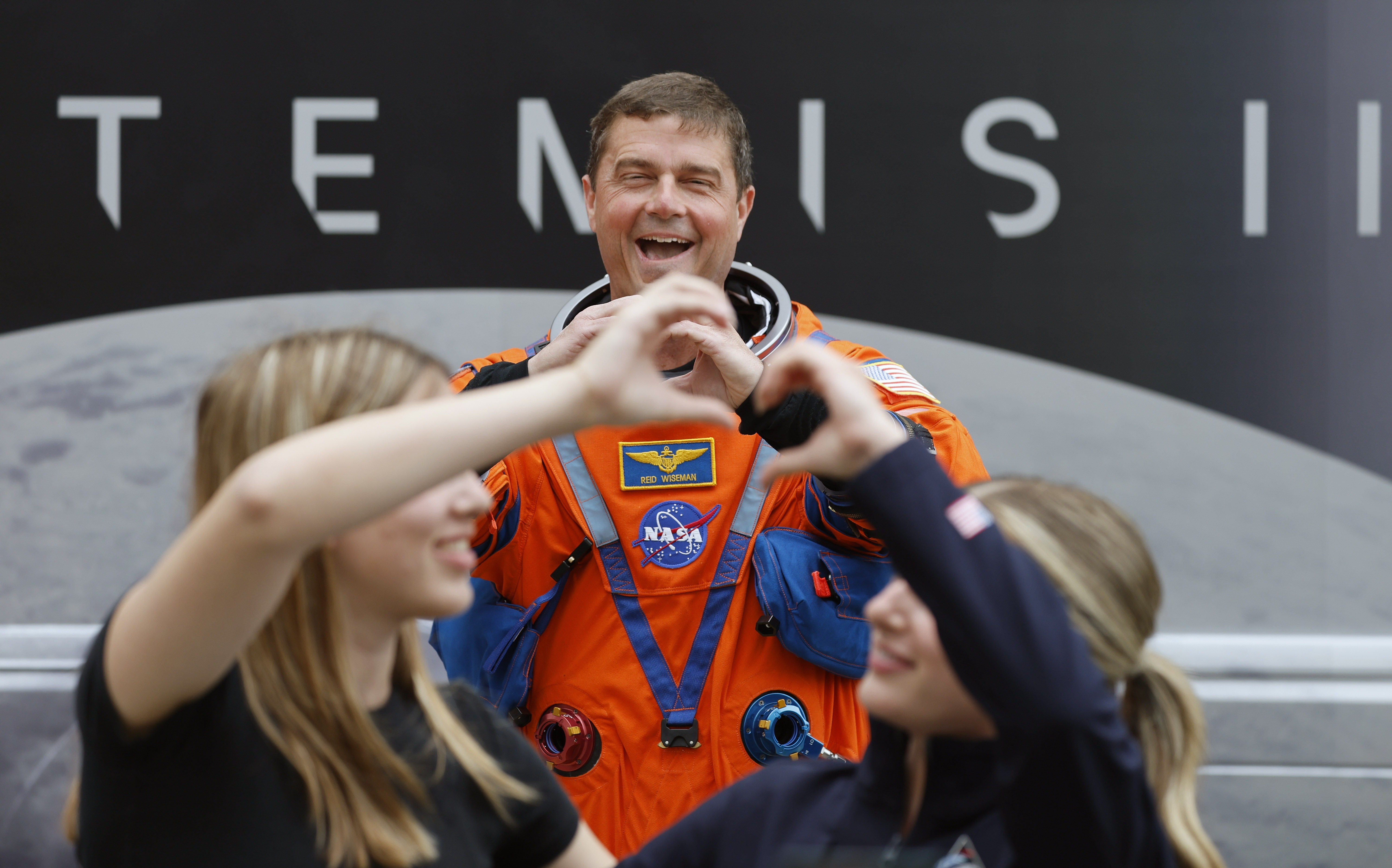 Artemis II commander Reid Wiseman poses for photos during the...