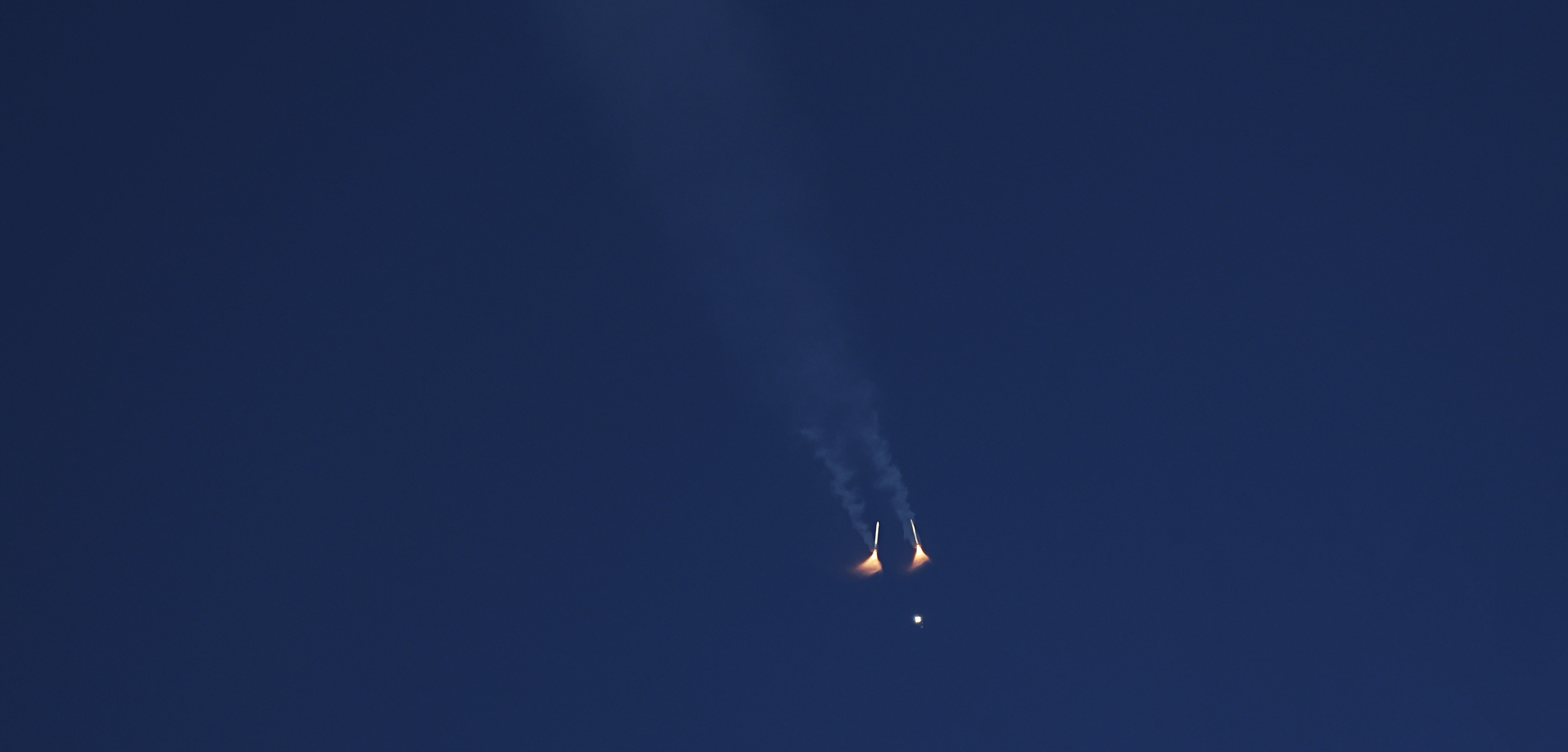 The solid rocket boosters separate during the launch of Artemis...