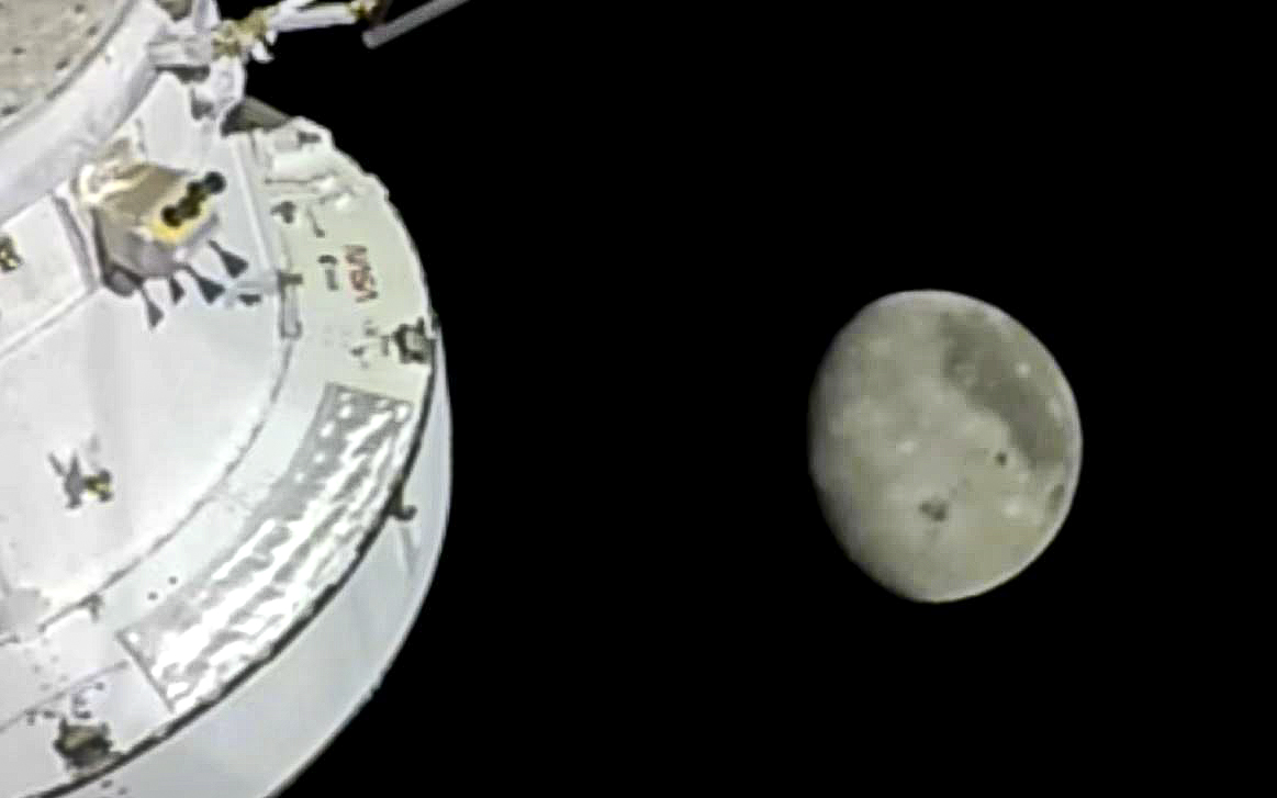 The Moon is seen from a camera outside the Orion...
