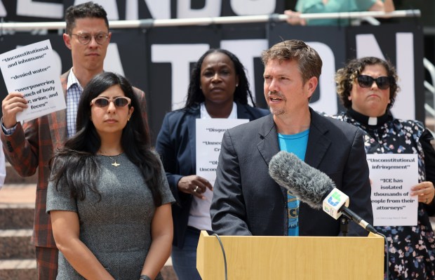 Corey Hill, a spokesman for 50501 Orlando, speaks during a press conference outside Orlando City Hall, calling on city leaders to be more forceful in their opposition of a potential ICE detention facility in east Orlando, on Monday, April 6, 2026. (Ricardo Ramirez Buxeda/ Orlando Sentinel)