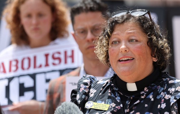Pastor Sarah Robinson of Audubon Park Church speaks during a press conference outside Orlando City Hall, calling on city leaders to be more forceful in their opposition of a potential ICE detention facility in east Orlando, on Monday, April 6, 2026. (Ricardo Ramirez Buxeda/ Orlando Sentinel)