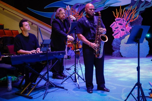 Central Florida Community Arts Jazz Trio, made up of Julian Bond on keyboard, Elijah Travis on sax and Joel Hanlon on bass, perform during the Orlando Sentinel 150th anniversary celebration forum on Orlando's arts scene at Orlando Family Stage on Monday, April 27, 2026.. (Rich Pope/Orlando Sentinel)