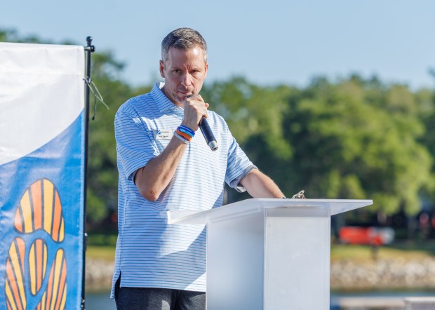 Todd Stewart, president of the Parkinson Association of Central Florida, speaks to participants in the 11th annual Walk for Parkinson, a charity event for the Parkinson Association of Central Florida. (Roger Simmons/Orlando Sentinel)