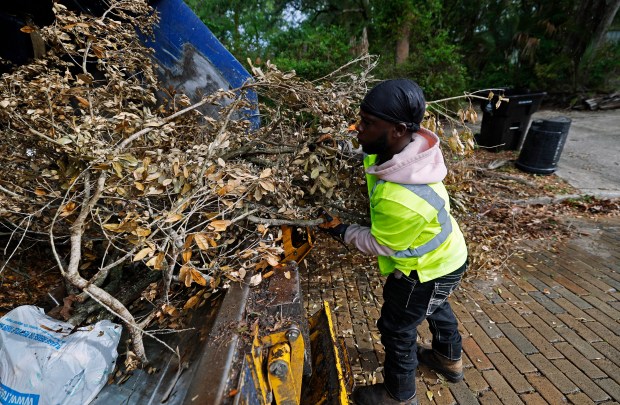 City of Orlando refuse collector Marquis Ashley picks up yard waste along East Concord Street, on Wednesday, April 8, 2026. (Ricardo Ramirez Buxeda/ Orlando Sentinel)