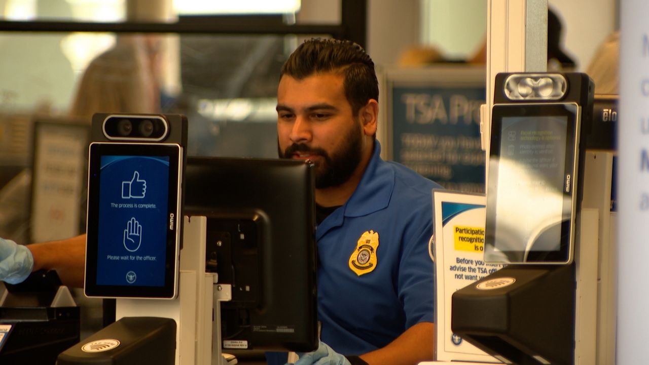 TSA officers at work at the Orlando International Airport. (Spectrum News/Elmancie Kelley)