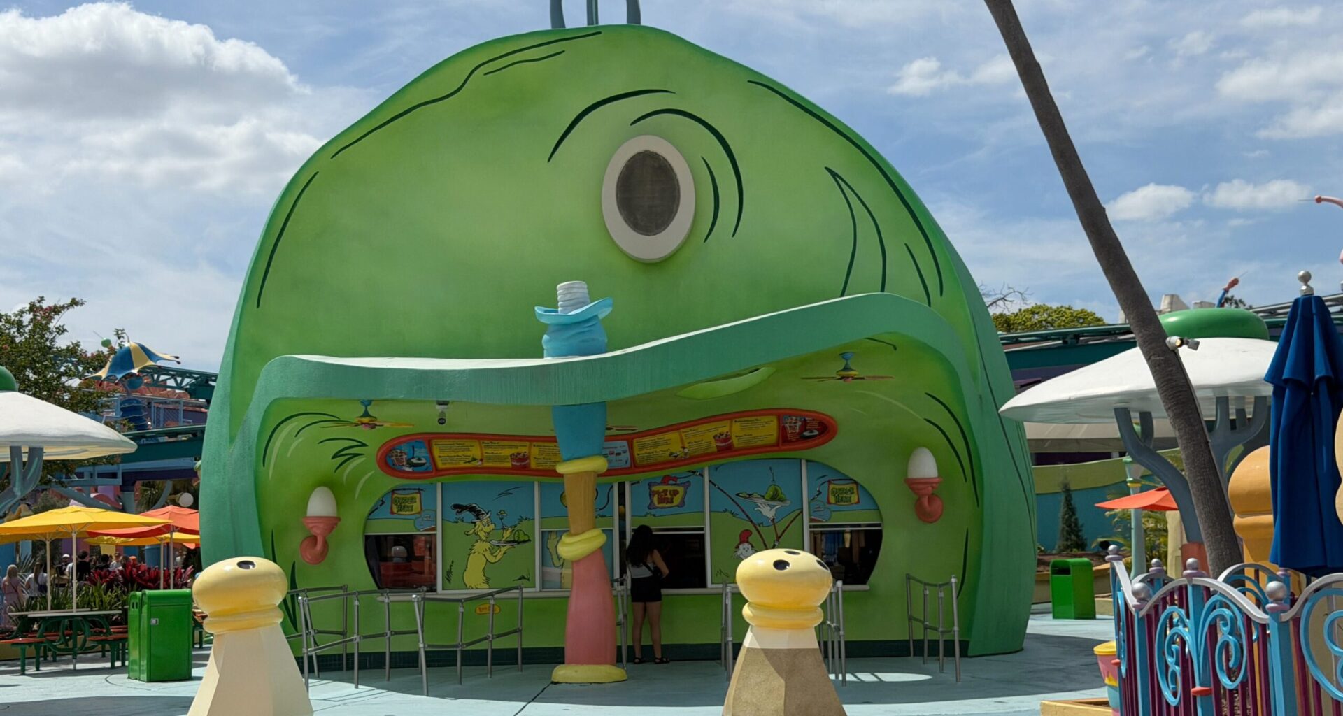 The scrim may have been removed from the Green Eggs and Ham Cafe in Islands of Adventure, but the sign is still missing.