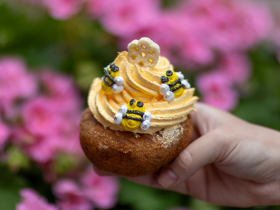 The Viking Bee Sting Doughnut ($5.25) from Voodoo Doughnut is a vanilla cake doughnut garnished with a boysenberry velvet top, candy bees, and honeycomb cereal.