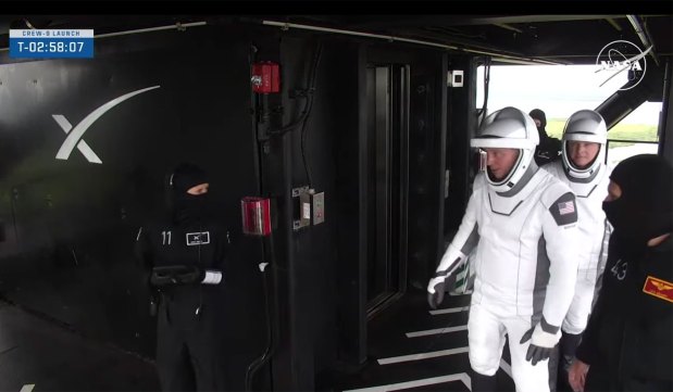 NASA astronaut Nick Hague and Roscosmos cosmonaut Aleksandr Gorbunov with SpaceX support crew and NASA astronaut Volusia County native Luke Delaney make their way to the top of the crew access arm to climb aboard the Crew Dragon Freedom atop a Falcon 9 rocket set to launch from Cape Canaveral Space Force Station's Space Launch Complex 40 ahead of the Crew-9 launch marking the debut human spaceflight for the launch pad on Saturday, Sept. 28, 2024. (NASA)