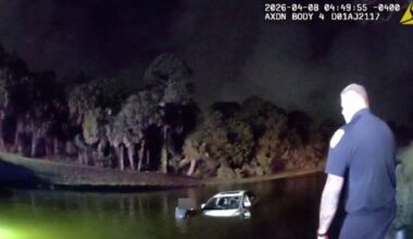 Elderly driver, passenger rescued after reversing into pond