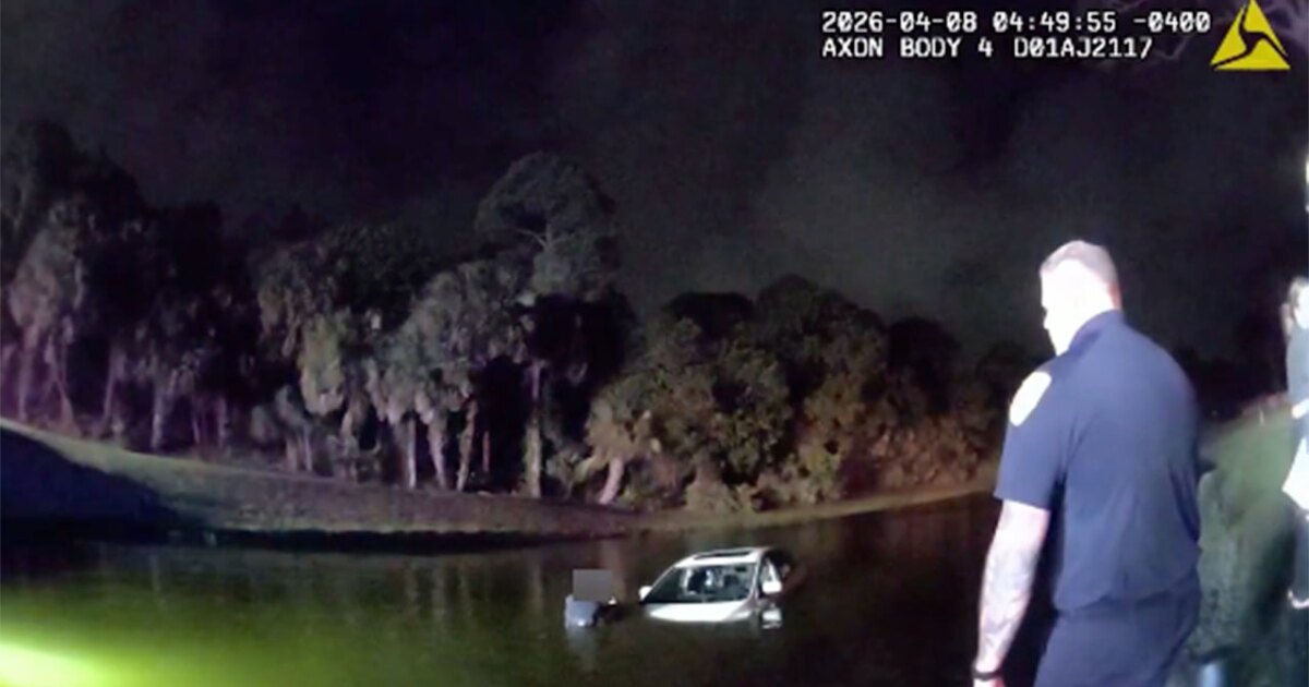 Elderly driver, passenger rescued after reversing into pond