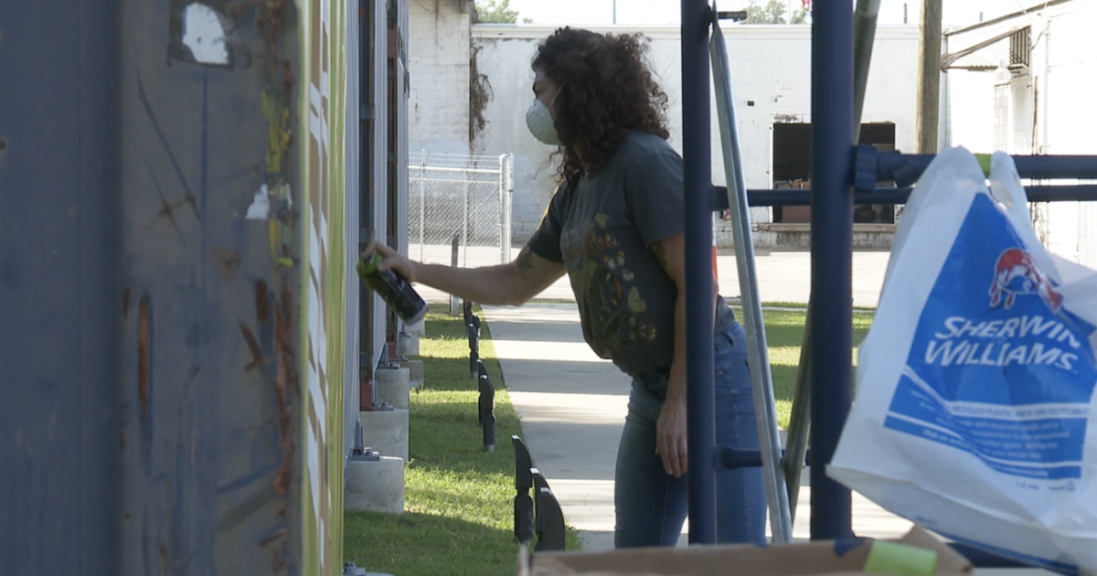 First two artists begin painting shipping container murals at SoMo Walls
