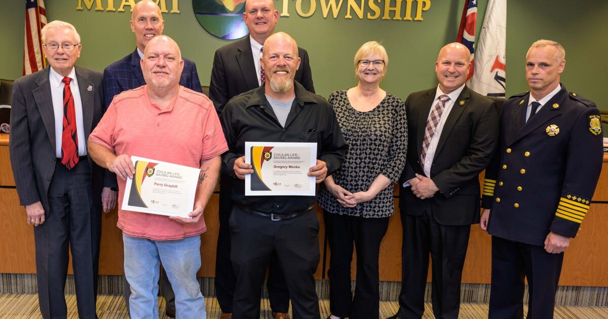 Two Miami Township residents honored for saving a man's life as his home burned