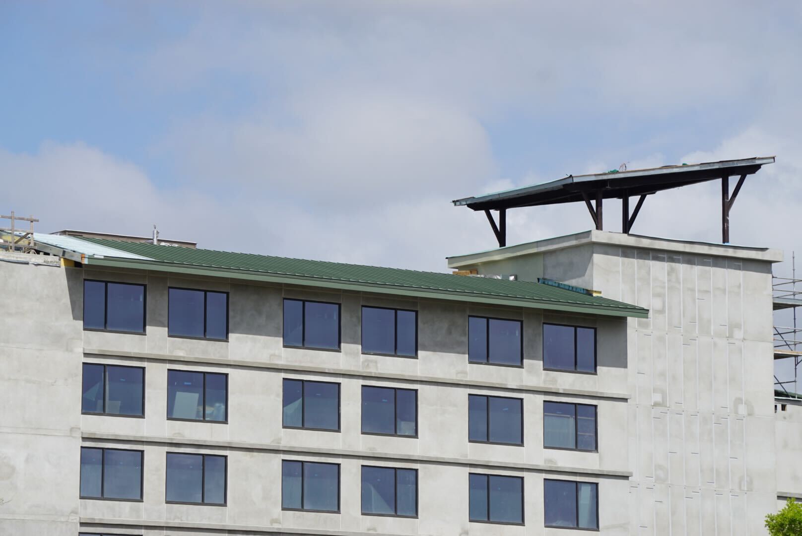Final roofing has been installed on a section of Disney Lakeshore Lodge, a new Disney Vacation Club resort under construction at Walt Disney World.