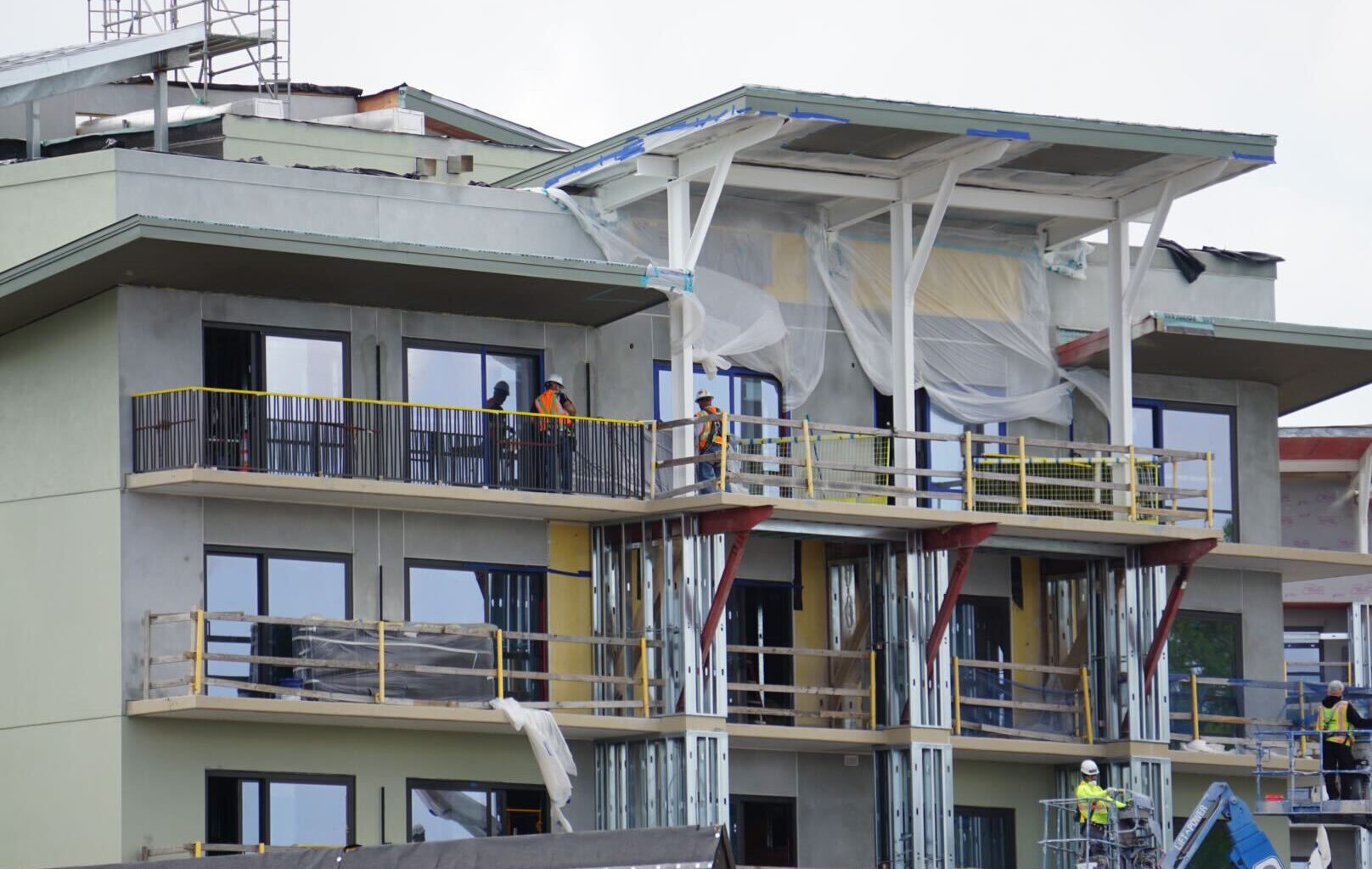 Close-up of Lakeshore Lodge building railings starting to be installed.