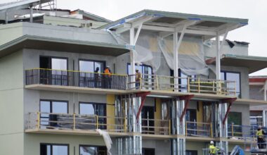 Close-up of Lakeshore Lodge building railings starting to be installed.