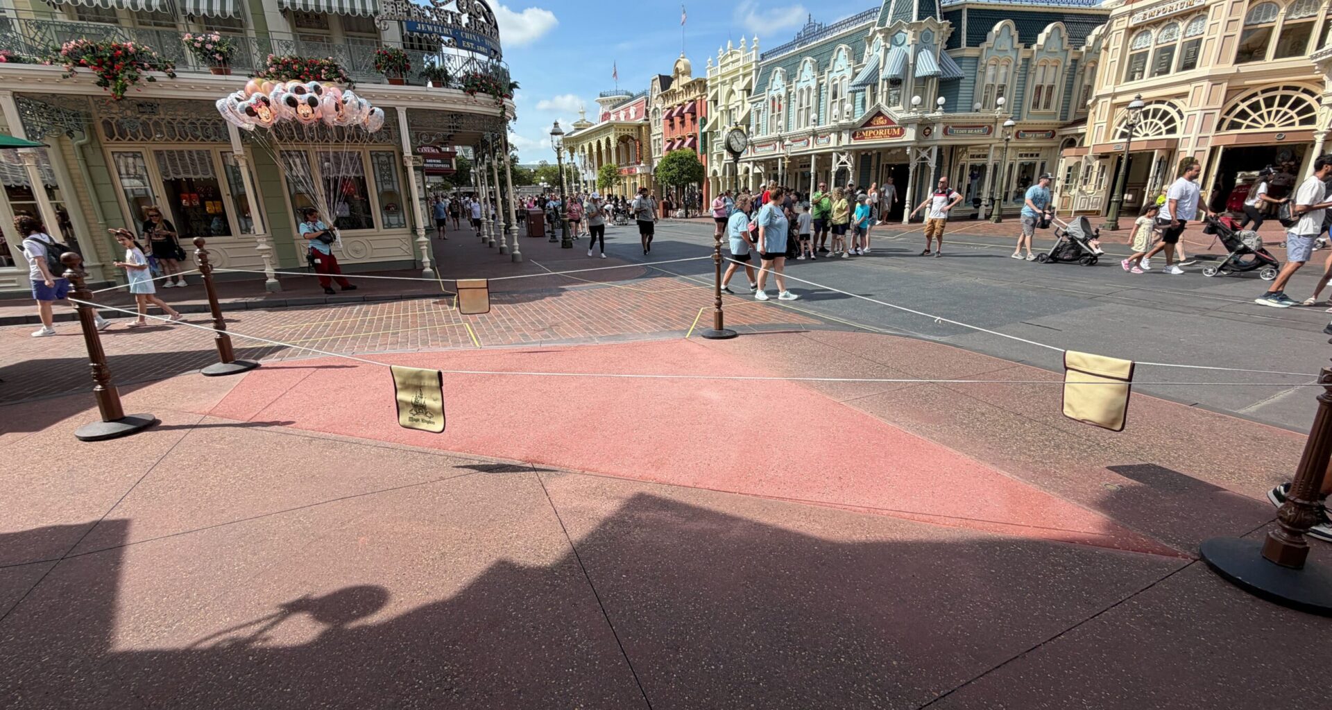 The pavement work that began three weeks ago outside Crystal Arts in Magic Kingdom appears to be complete. Since construction began, a large patch of pavement was covered by temporary wood boards.