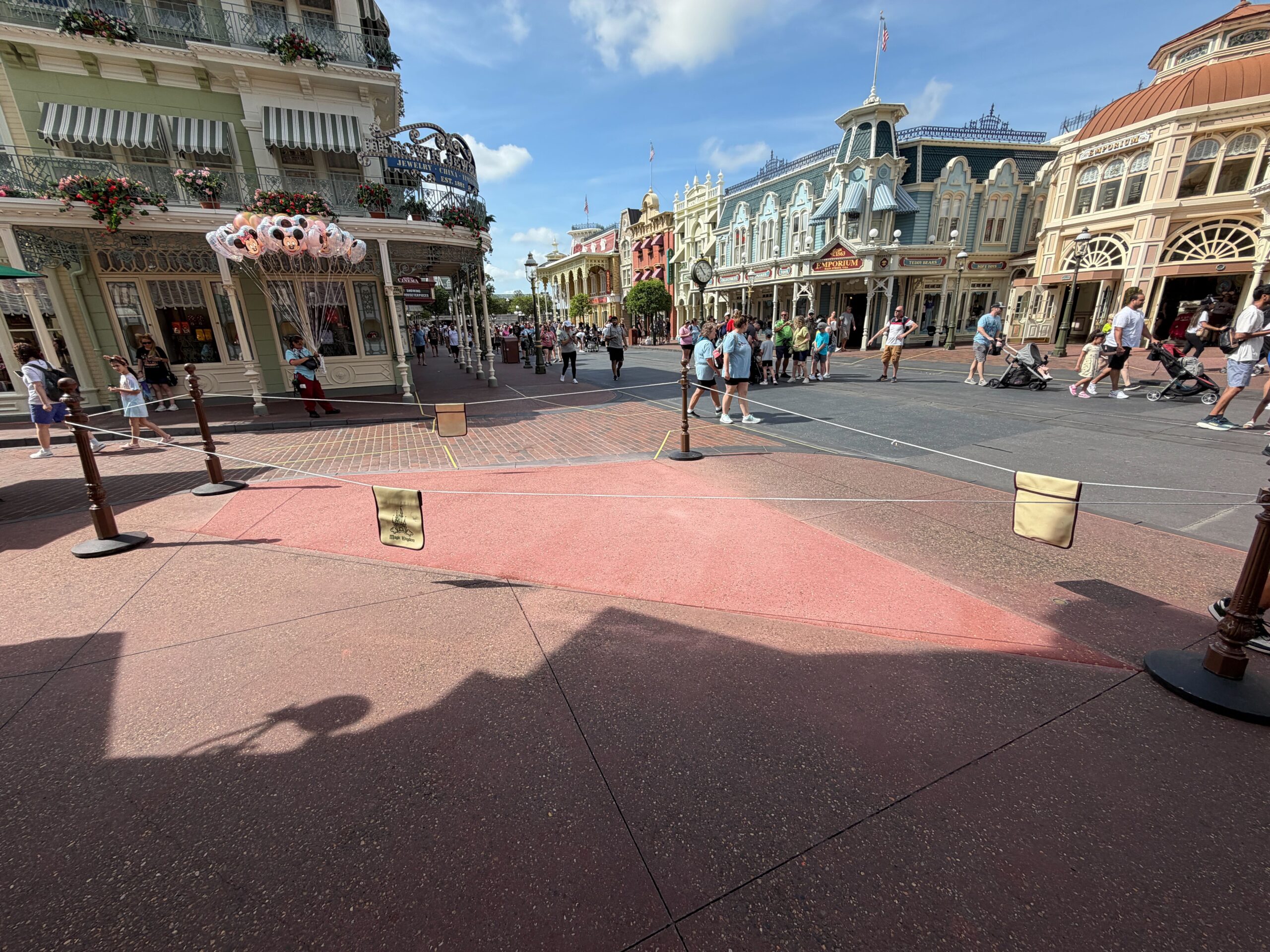 The pavement work that began three weeks ago outside Crystal Arts in Magic Kingdom appears to be complete. Since construction began, a large patch of pavement was covered by temporary wood boards.