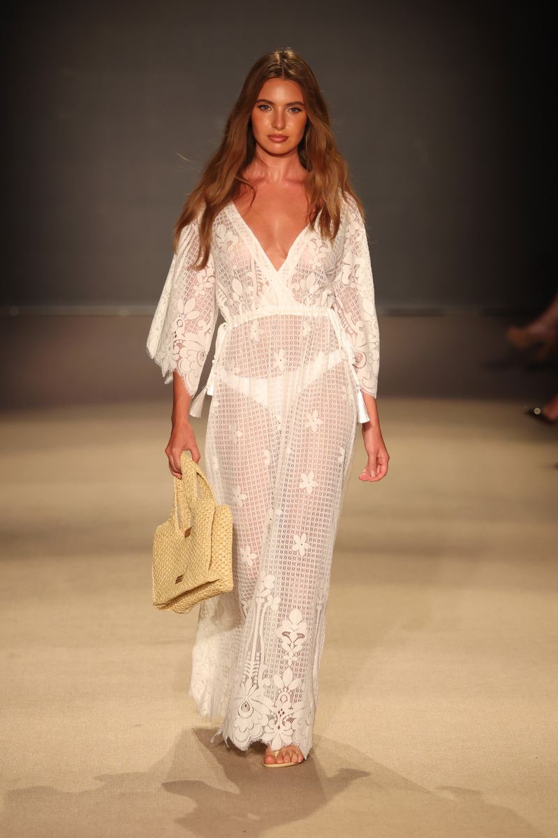 Lightweight transparent fabrics reinforced the season's breezy, vacation-inspired aesthetic.
