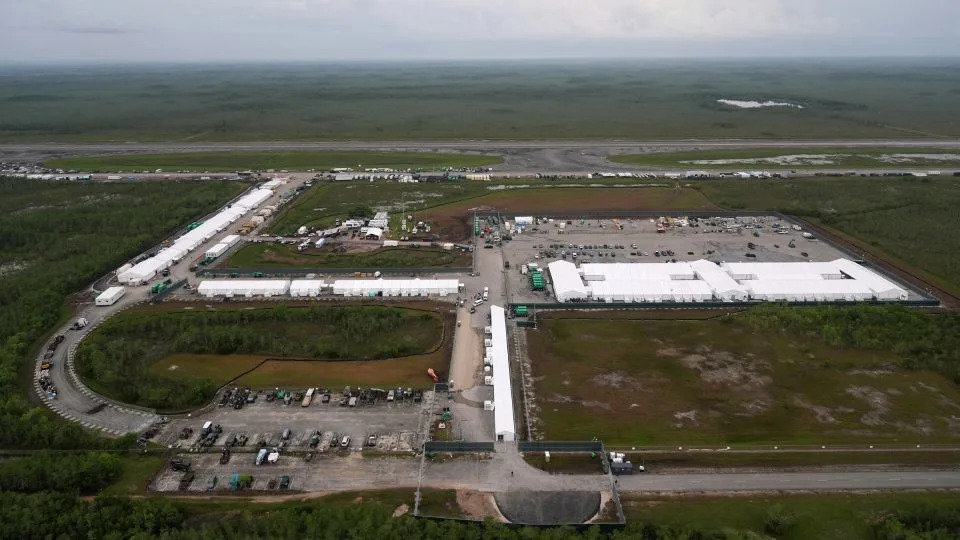 Work progresses on a new migrant detention facility dubbed "Alligator Alcatraz," at Dade-Collier Training and Transition Airport in the Florida Everglades, on July 4, 2025, in Ochopee, Florida. - Rebecca Blackwell/AP/File