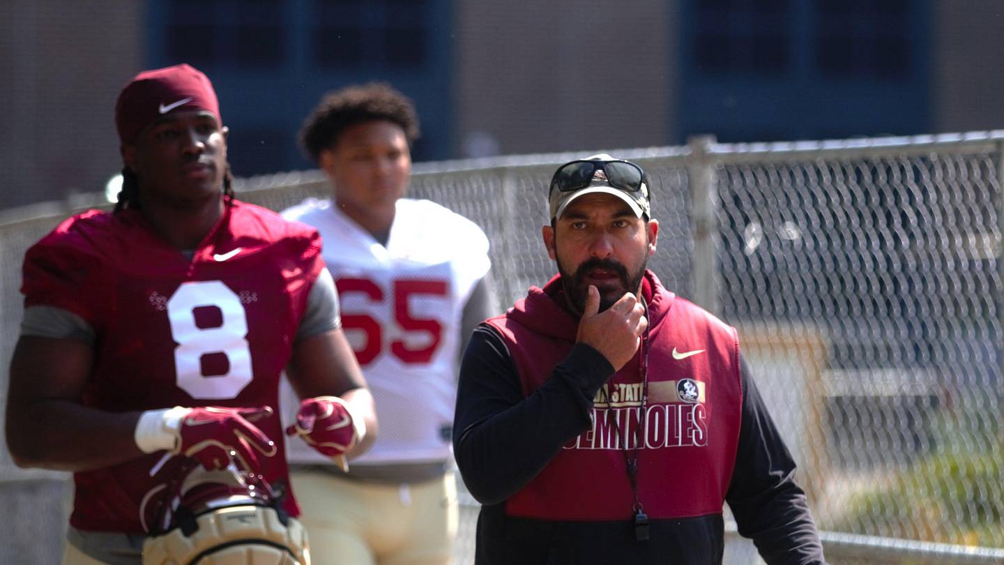 FSU football players and coaches walk into the first spring practice of the spring season on Wednesday, March 19, 2025
