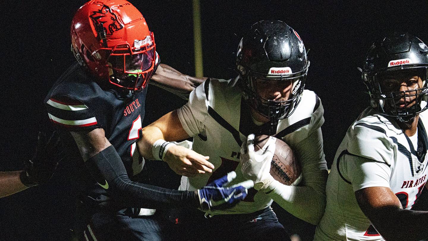 Logan Flaherty,#17, the qurterback for the Port Charlotte football team gains yards at South Fort Myers on Thursday, Sept. 25, 2025.