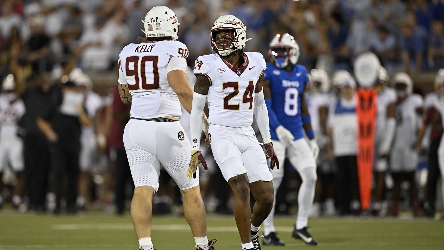 Sep 28, 2024; Dallas, Texas, USA; Florida State Seminoles defensive lineman Grady Kelly (90) and defensive back K.J. Kirkland (24) celebrate during the game between the Southern Methodist Mustangs and the Florida State Seminoles at Gerald J. Ford Stadium. Mandatory Credit: Jerome Miron-Imagn Images