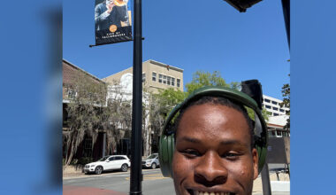 Florida A&M University alumnus Gamaliel Harris poses beneath a City of Tallahassee banner featuring his image from a past performance. Harris, a 2025 graduate, will begin Juilliard’s graduate jazz studies program this fall. (Photo courtesy: Gamaliel Harris)